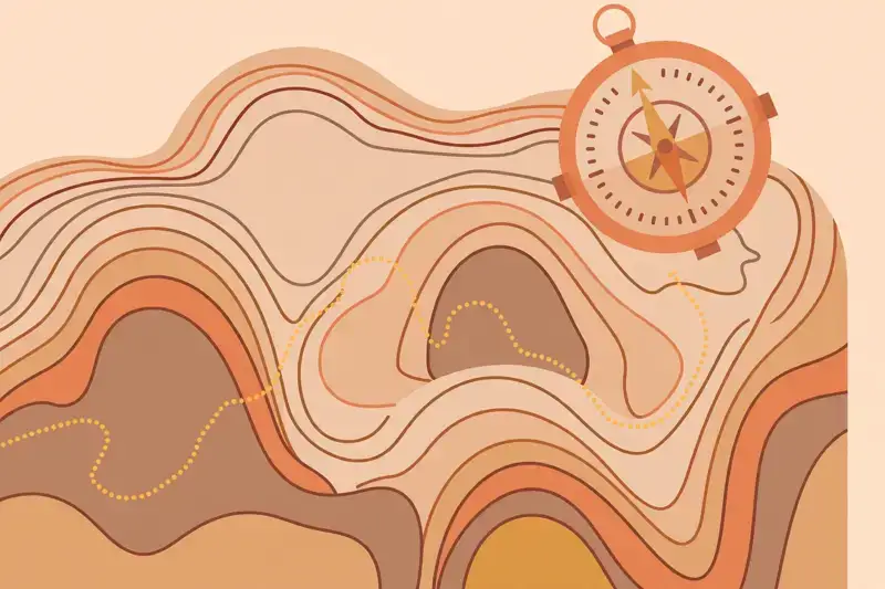 A topographic trail map with a compass laid on top of it